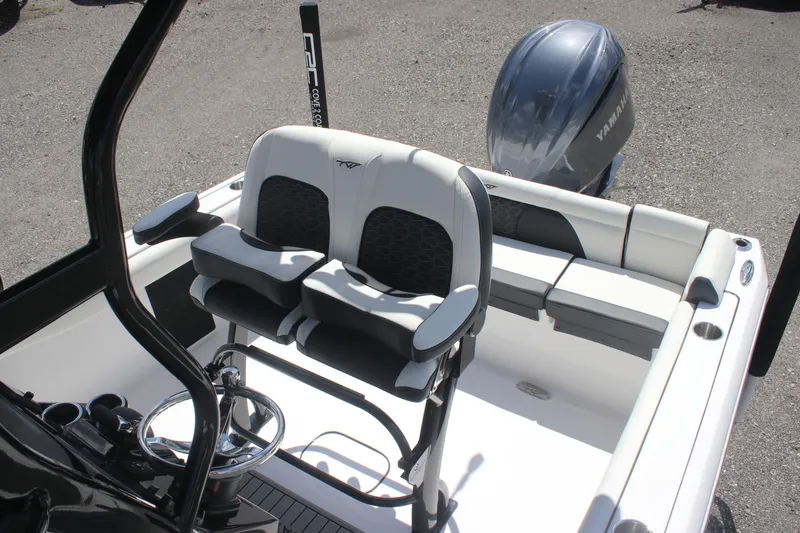 Slide: The Image of 2026 Tidewater 232 LXF boat interior with dual seats and Yamaha engine. - 11