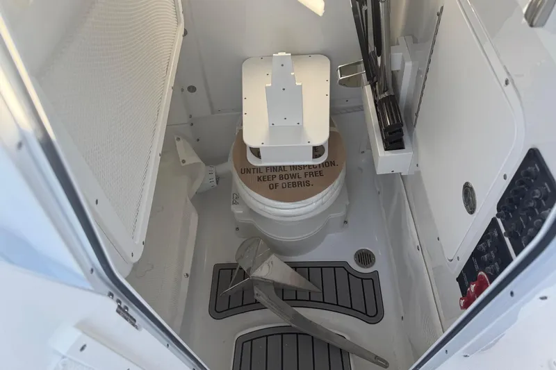 Slide: The Image of Interior of Sea Hunt Ultra 255 SE 2026 with toilet. - 19