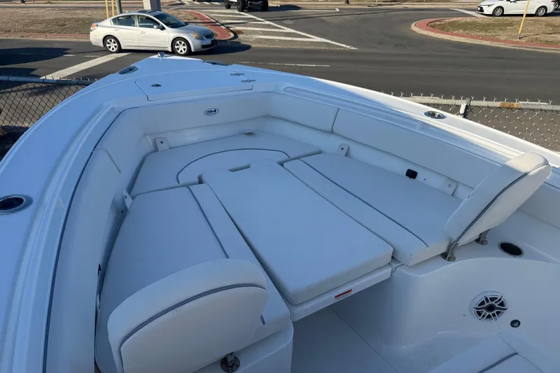 Slide: The Image of 2026 Sea Hunt Ultra 255 SE boat with spacious white seating area. - 3