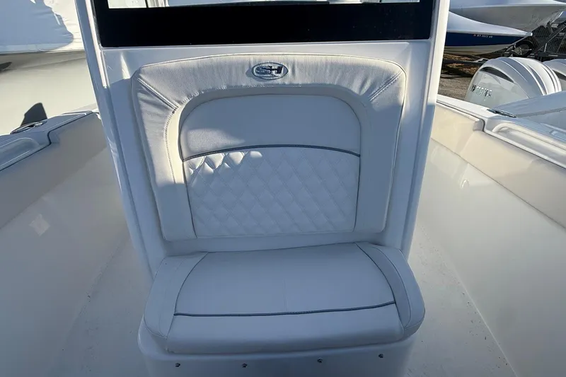 Slide: The Image of 2026 Sea Hunt Ultra 255 SE boat seat with quilted white upholstery. - 5