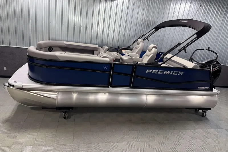 The Image of 2026 Premier 200 Sunscape RL Tritoon boat in showroom, featuring sleek design and comfortable seating. - 1