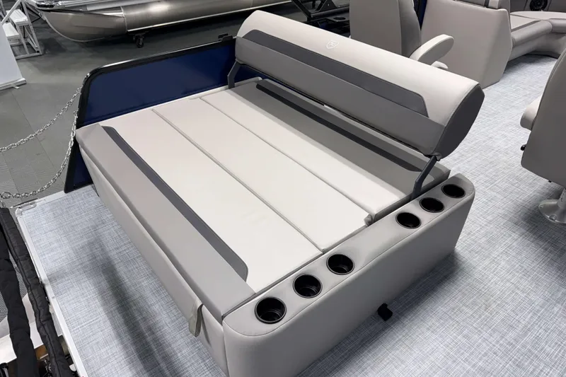 Slide: The Image of 2026 Premier 200 Sunscape RL Tritoon boat interior with convertible seating and cup holders. - 11