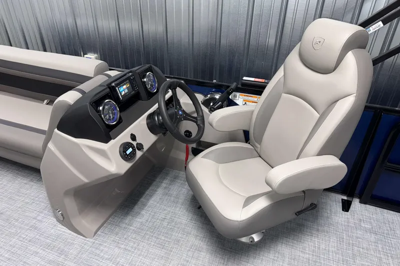 Slide: The Image of Captain's seat and helm of 2026 Premier 200 Sunscape RL Tritoon boat. - 14