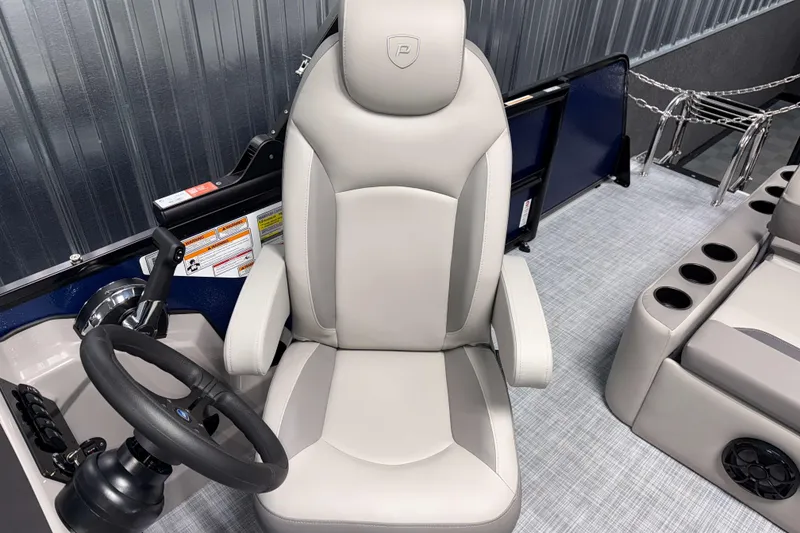 Slide: The Image of Captain's chair in 2026 Premier 200 Sunscape RL Tritoon boat, featuring modern design and controls. - 15