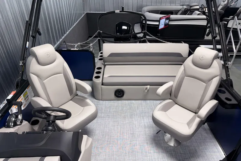 Slide: The Image of 2026 Premier 200 Sunscape RL Tritoon interior with plush seating and modern design. - 17