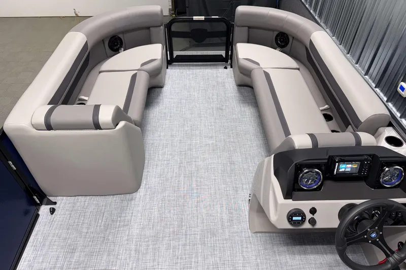 Slide: The Image of 2026 Premier 200 Sunscape RL Tritoon interior with plush seating and modern dashboard. - 18