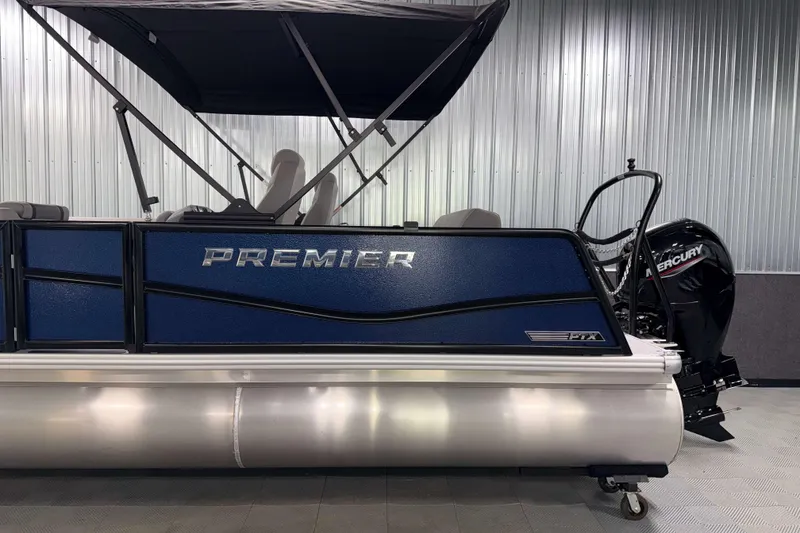 Slide: The Image of 2026 Premier 200 Sunscape RL Tritoon boat with Mercury engine in showroom. - 6