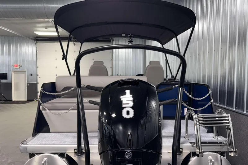 Slide: The Image of 2026 Premier 200 Sunscape RL Tritoon with 150 HP engine in a showroom. - 7