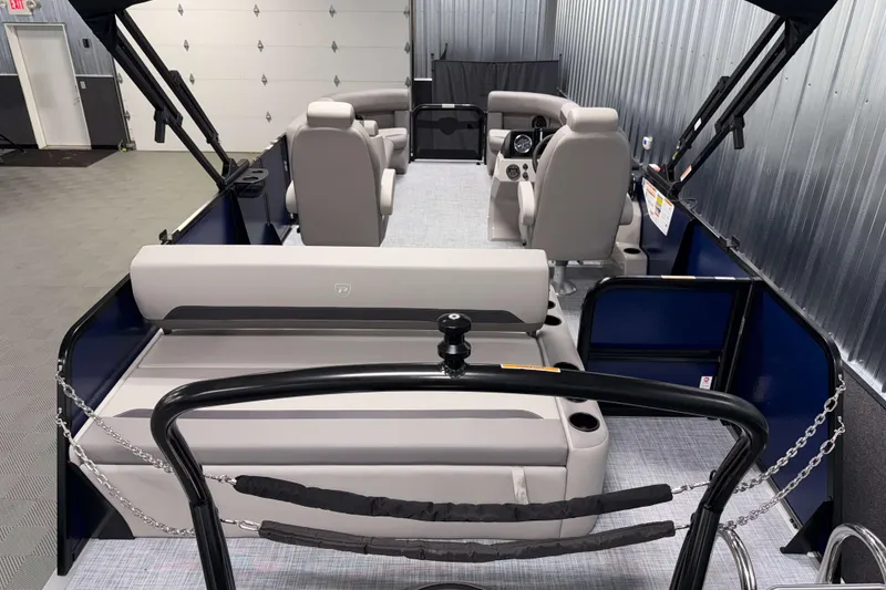 Slide: The Image of 2026 Premier 200 Sunscape RL Tritoon interior with luxurious seating and modern design. - 9