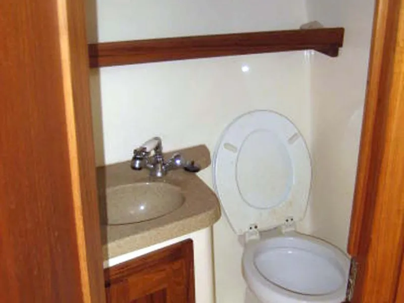 Slide: The Image of 2005 Albemarle 310 Sport Fisherman boat bathroom with sink and toilet. - 10