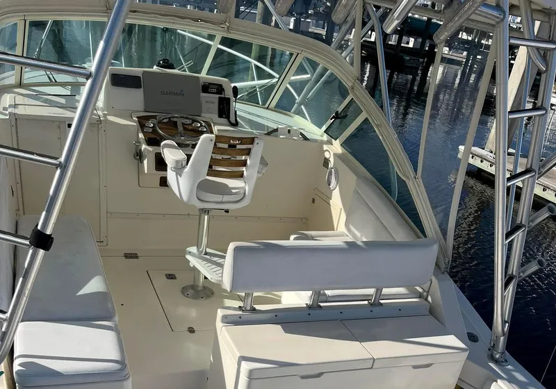 Slide: The Image of 2005 Albemarle 310 Sport Fisherman boat interior with helm and seating. - 14