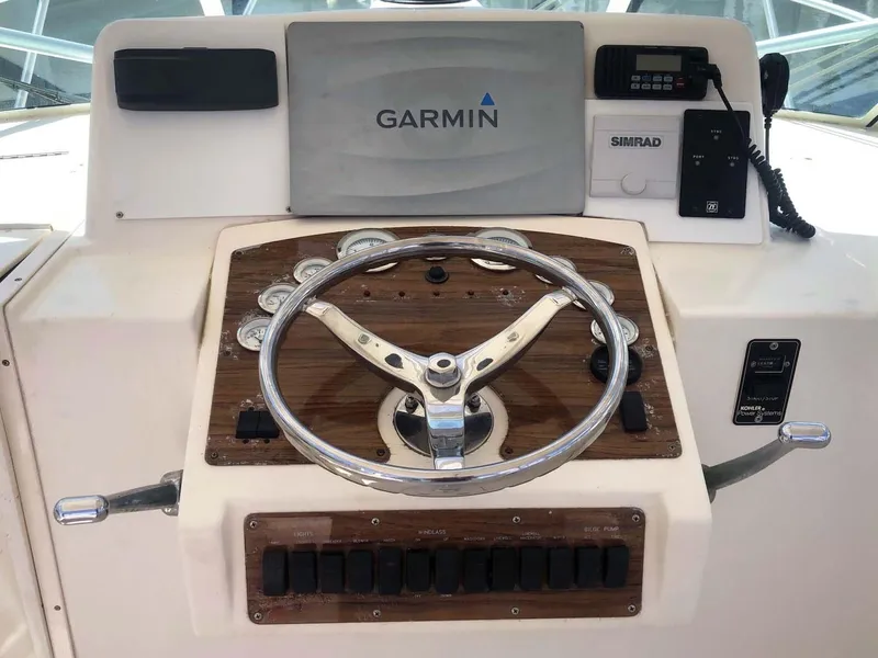 Slide: The Image of 2005 Albemarle 310 Sport Fisherman helm with Garmin and Simrad electronics. - 4