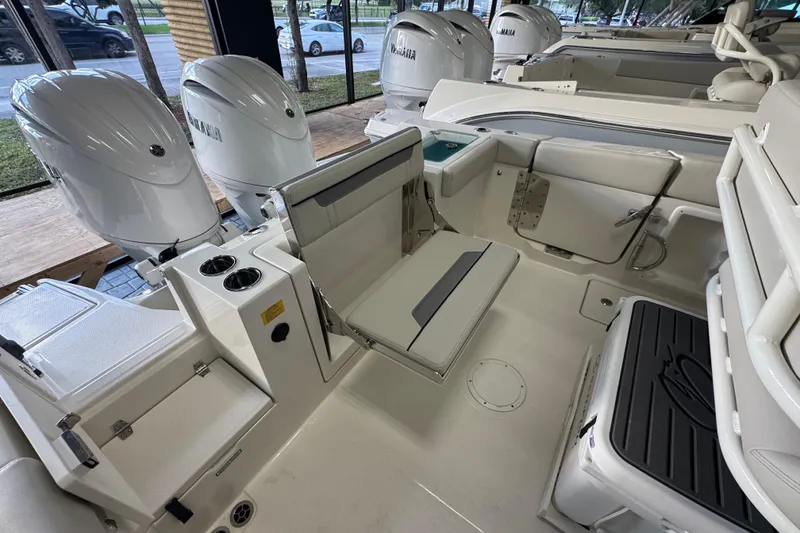 Slide: The Image of 2026 Sailfish 252 CC boat interior with seating and Yamaha engines. - 14