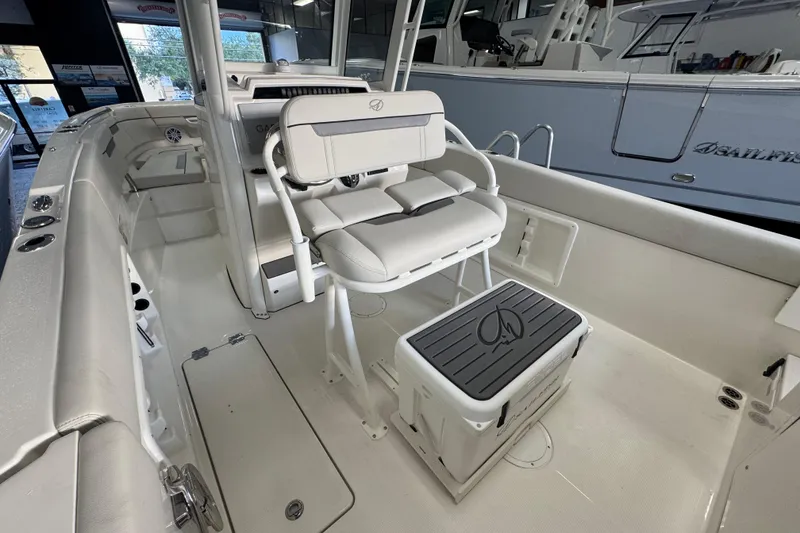 Slide: The Image of 2026 Sailfish 252 CC boat interior with seating and storage, showcasing modern design. - 15