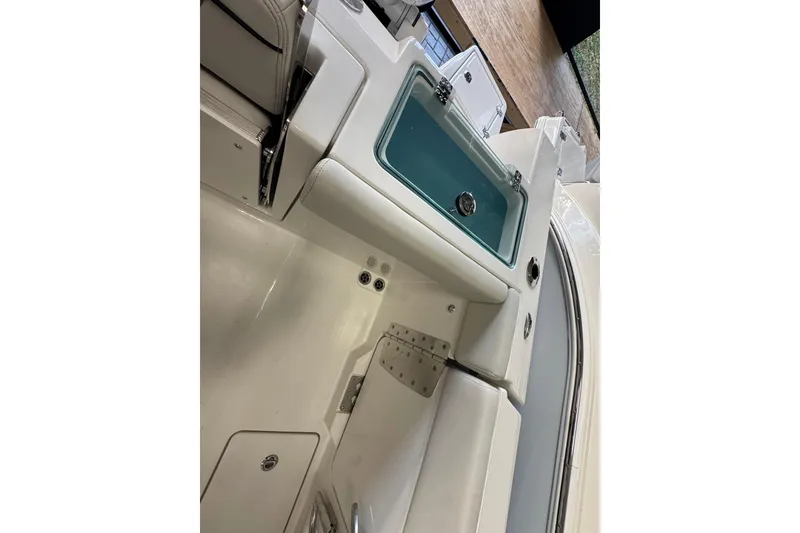 Slide: The Image of Interior view of 2026 Sailfish 252 CC boat, featuring seating and storage compartments. - 17