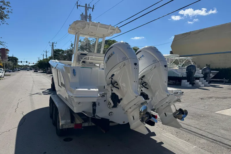 Slide: The Image of 2026 Sailfish 252 CC boat with dual Yamaha engines on a trailer. - 20
