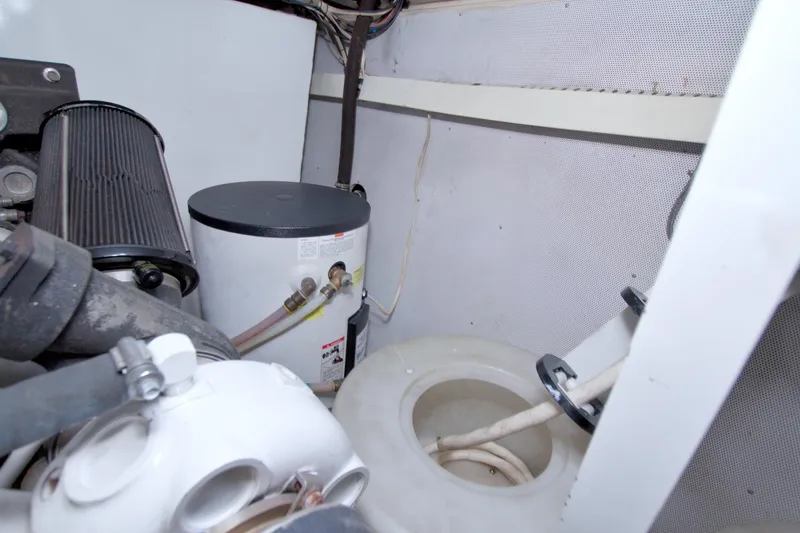 Slide: The Image of Engine room of 2005 Neptunus 62 Flybridge yacht, showing mechanical components. - 101