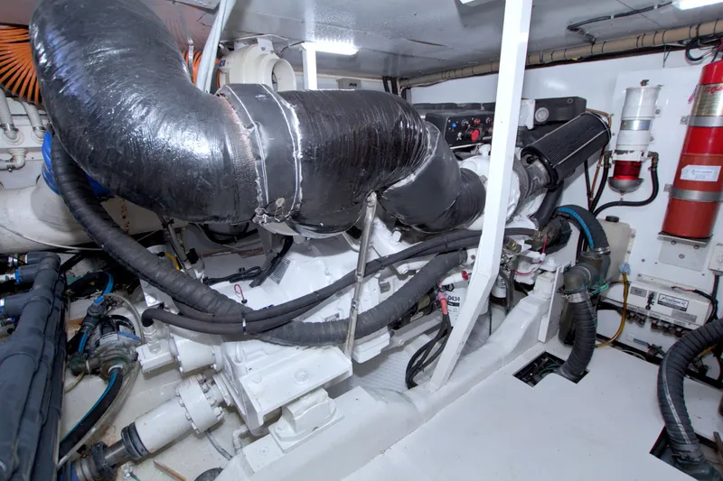 Slide: The Image of Engine room of 2005 Neptunus 62 Flybridge yacht, showcasing machinery and components. - 106