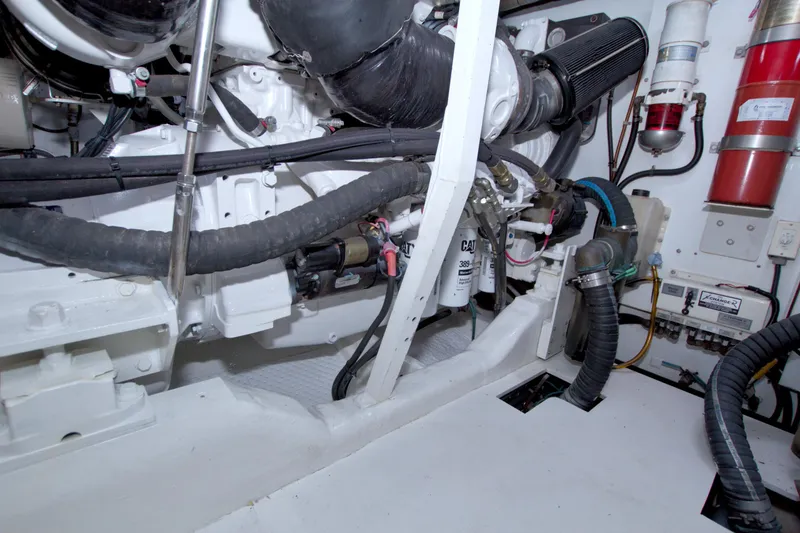 Slide: The Image of Engine room of 2005 Neptunus 62 Flybridge yacht, showcasing mechanical components and systems. - 107