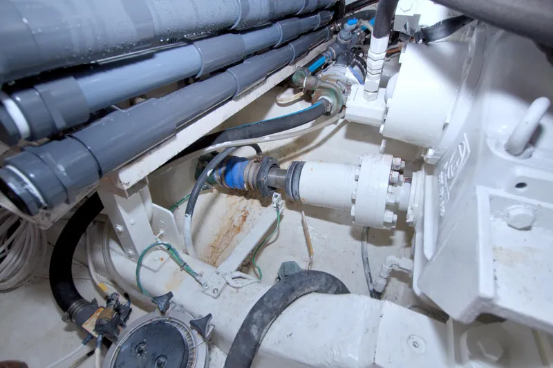 Slide: The Image of Engine room of 2005 Neptunus 62 Flybridge yacht, showcasing mechanical components and piping. - 110