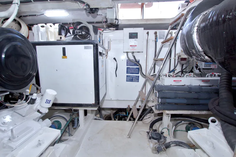 Slide: The Image of Engine room of 2005 Neptunus 62 Flybridge yacht with equipment and machinery. - 114