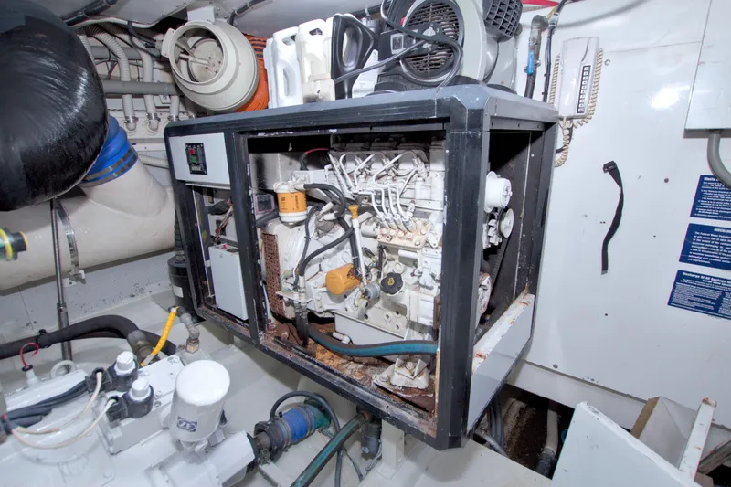 Slide: The Image of Engine room of 2005 Neptunus 62 Flybridge yacht, showcasing machinery and components. - 116