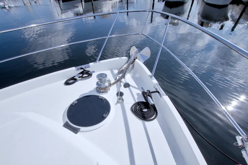 Slide: The Image of Bow of 2005 Neptunus 62 Flybridge yacht with anchor and winch. - 12