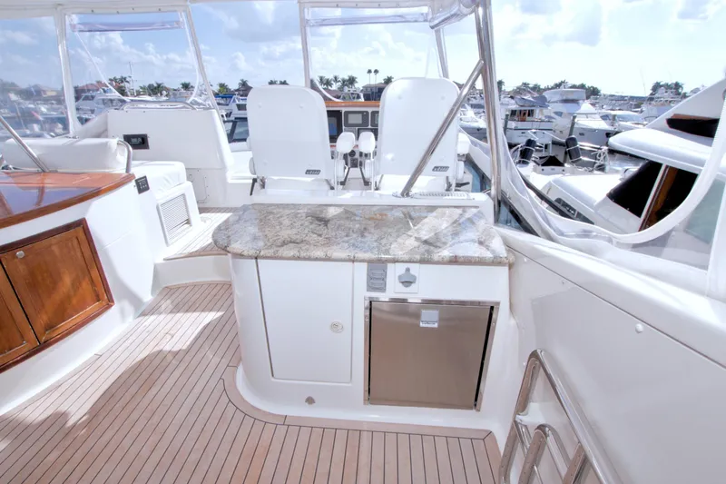 Slide: The Image of Luxurious 2005 Neptunus 62 Flybridge yacht interior with elegant seating and granite countertop. - 20