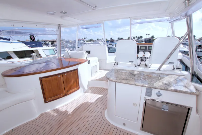 Slide: The Image of Luxurious 2005 Neptunus 62 Flybridge yacht interior with elegant seating and modern amenities. - 21
