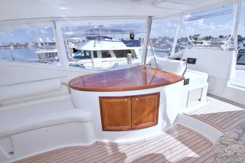 Slide: The Image of Luxurious 2005 Neptunus 62 Flybridge yacht interior with elegant wood accents and panoramic views. - 22