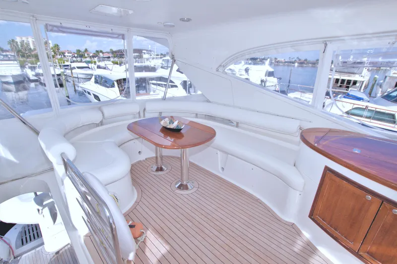 Slide: The Image of Luxurious 2005 Neptunus 62 Flybridge yacht interior with elegant seating and wooden accents. - 33