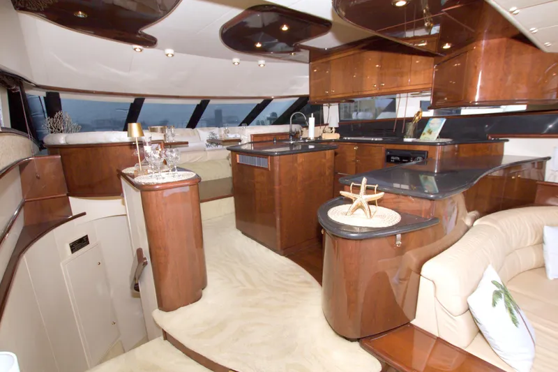 Slide: The Image of Luxurious interior of 2005 Neptunus 62 Flybridge yacht with elegant wood finishes. - 41