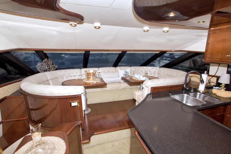 Slide: The Image of Luxurious interior of 2005 Neptunus 62 Flybridge yacht with elegant seating and modern amenities. - 48