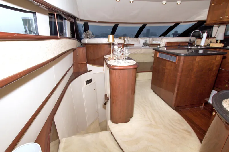 Slide: The Image of Luxurious interior of 2005 Neptunus 62 Flybridge yacht with elegant wood finishes. - 51