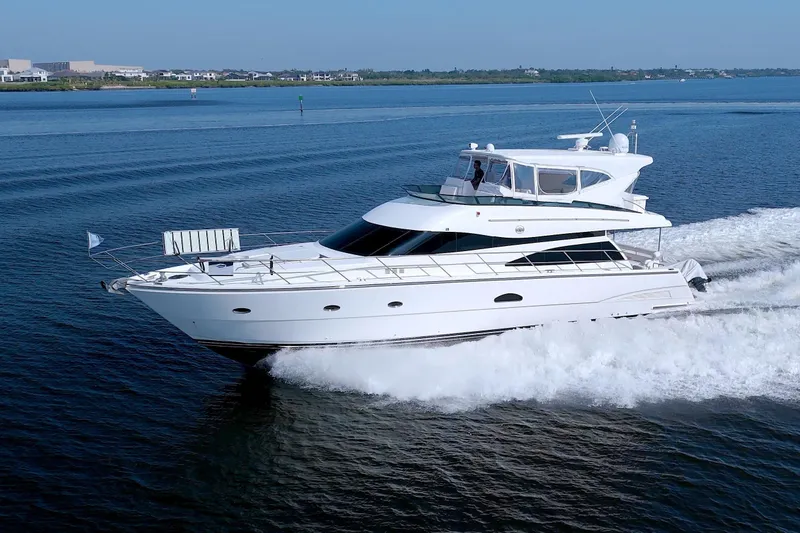 Slide: The Image of 2005 Neptunus 62 Flybridge yacht cruising on open water. - 6