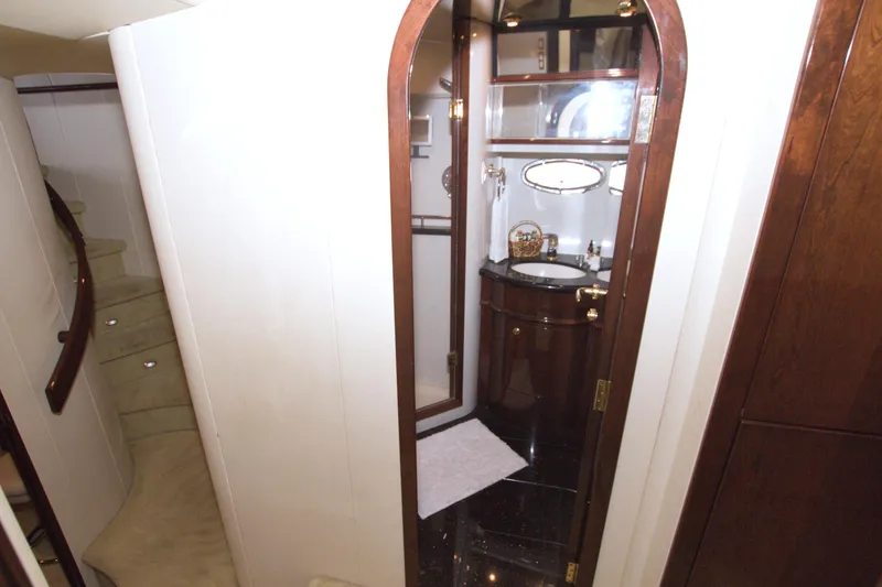 Slide: The Image of Luxurious bathroom interior of 2005 Neptunus 62 Flybridge yacht with elegant wood finishes. - 62