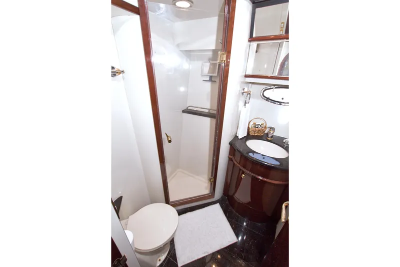 Slide: The Image of Luxurious bathroom in 2005 Neptunus 62 Flybridge yacht with shower and elegant fixtures. - 63