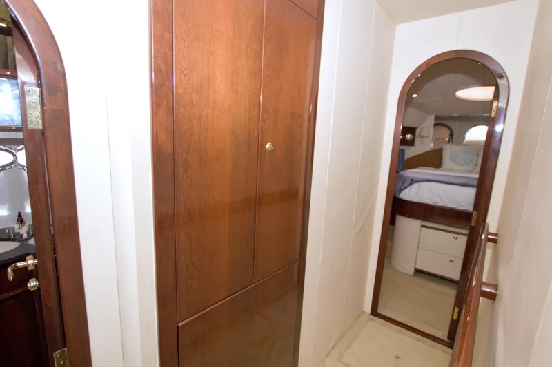 Slide: The Image of Luxurious interior hallway of 2005 Neptunus 62 Flybridge yacht with wooden cabinetry. - 67