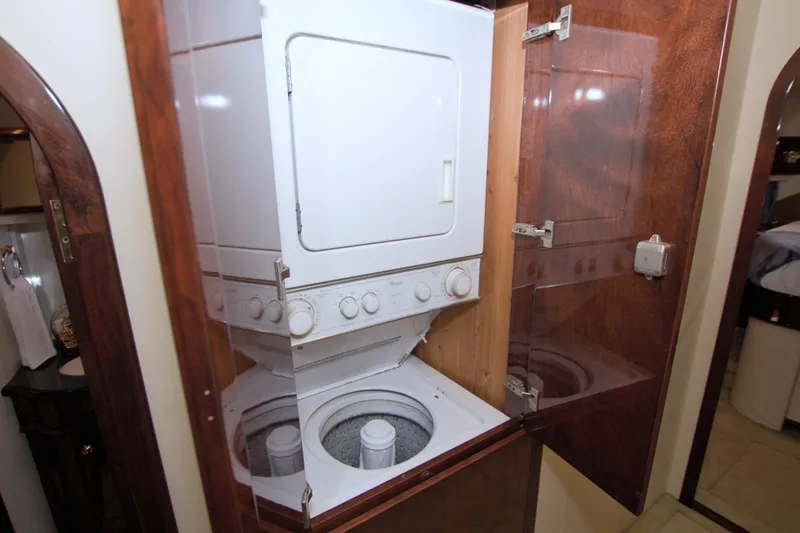 Slide: The Image of Stacked washer and dryer in 2005 Neptunus 62 Flybridge yacht interior. - 68