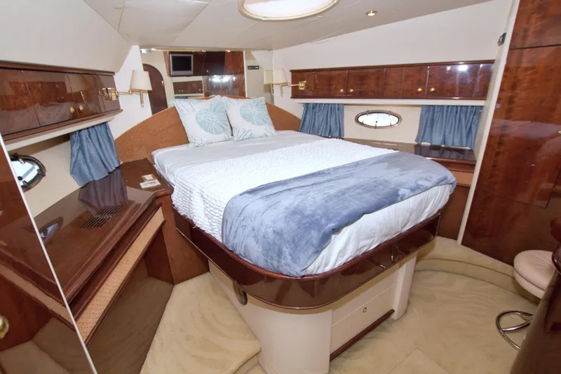 Slide: The Image of Luxurious bedroom interior of 2005 Neptunus 62 Flybridge yacht with elegant wood finishes. - 70