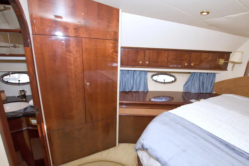 Slide: The Image of Luxurious cabin interior of 2005 Neptunus 62 Flybridge yacht with wood finishes. - 73