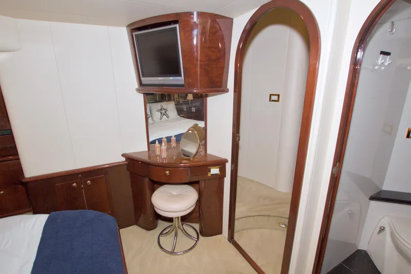 Slide: The Image of Luxurious cabin interior of 2005 Neptunus 62 Flybridge yacht with vanity and TV. - 81