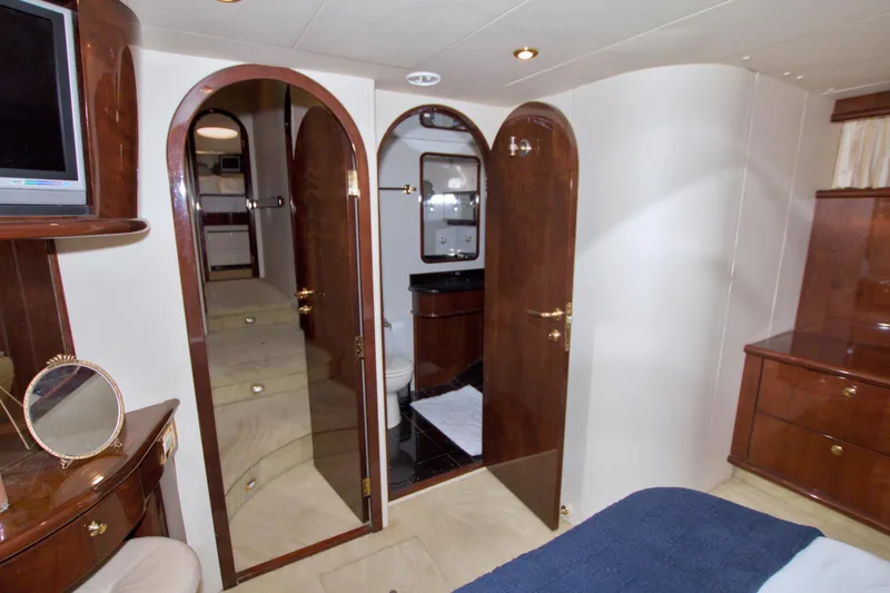 Slide: The Image of Luxurious interior of 2005 Neptunus 62 Flybridge yacht with elegant wood finishes. - 86