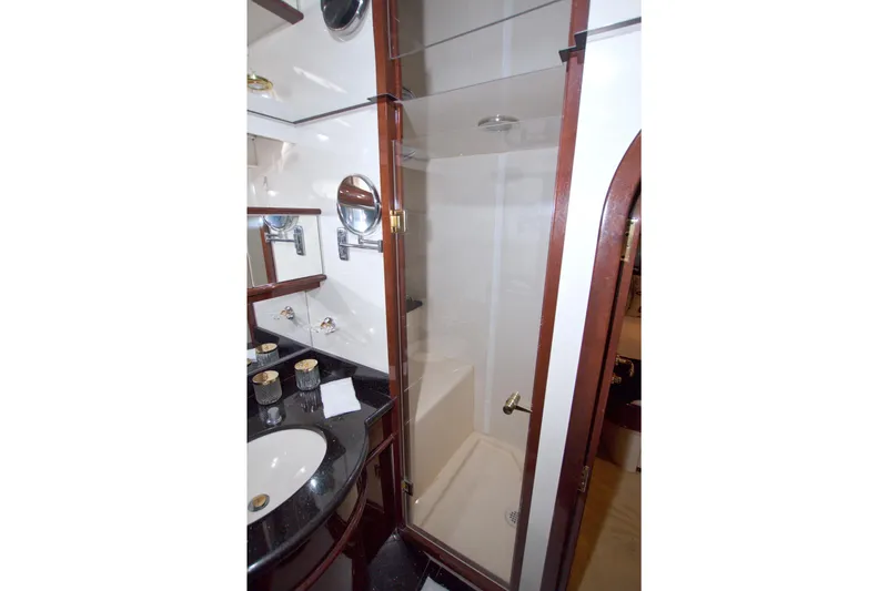 Slide: The Image of Luxurious bathroom in 2005 Neptunus 62 Flybridge yacht with glass shower and elegant fixtures. - 89