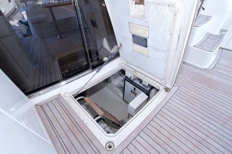 Slide: The Image of 2005 Neptunus 62 Flybridge yacht engine compartment with CAT machinery visible. - 92