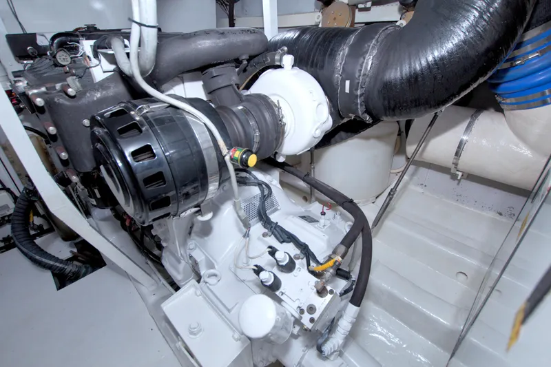 Slide: The Image of Engine room of 2005 Neptunus 62 Flybridge yacht, showcasing mechanical components. - 97