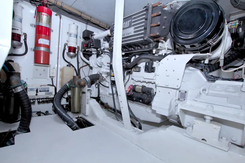 Slide: The Image of Engine room of 2005 Neptunus 62 Flybridge yacht, featuring CAT marine power system. - 99