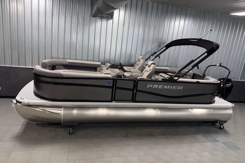 The Image of 2026 Premier 220 Sunscape RF pontoon boat in a showroom, featuring sleek design and modern seating. - 0