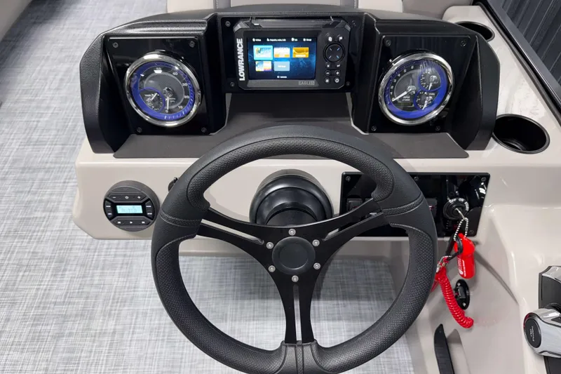 Slide: The Image of Steering console of 2026 Premier 220 Sunscape RF with gauges and navigation system. - 11