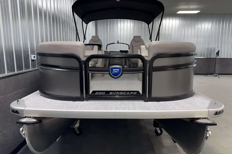 Slide: The Image of 2026 Premier 220 Sunscape RF pontoon boat in a showroom setting. - 2